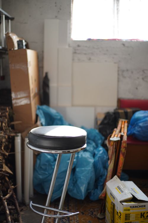 Cluttered indoor space with household items ready for a cleanout