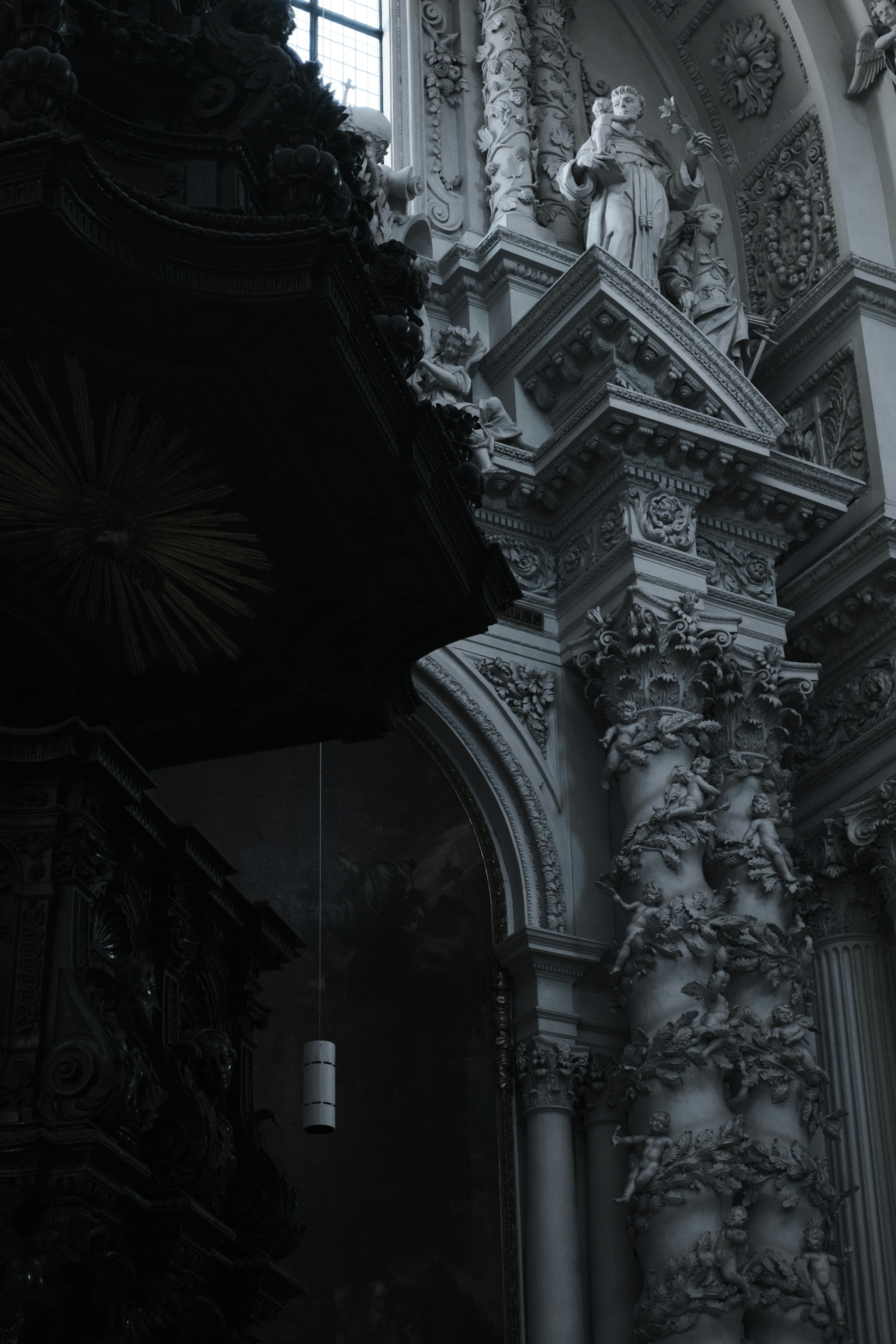 Explore the ornate stucco and column details of a Baroque church in Munich, Germany.