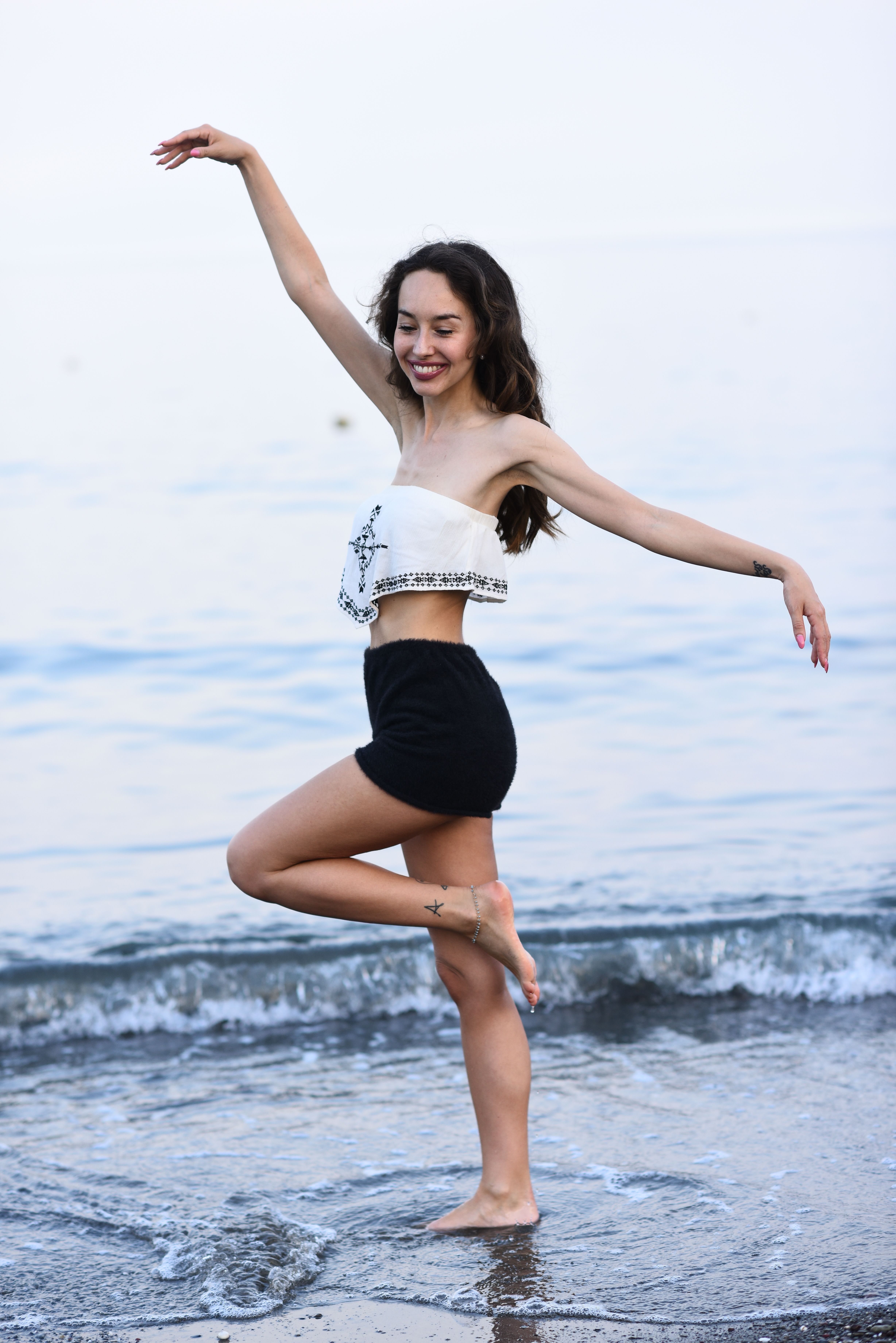Brunette Woman Posing by the Sea · Free Stock Photo