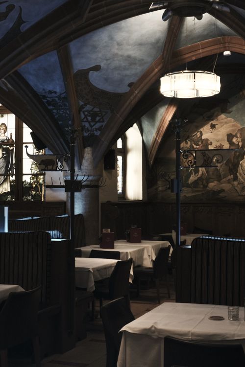 Free Elegant interior of a historic restaurant in Munich, Germany, with Gothic arches. Stock Photo