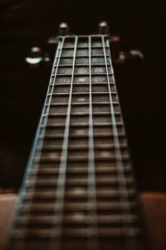 Selective Focus Photo of Fretboard
