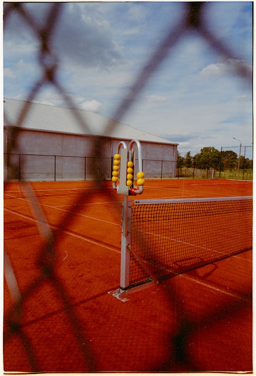 Tennis Court behind Fence