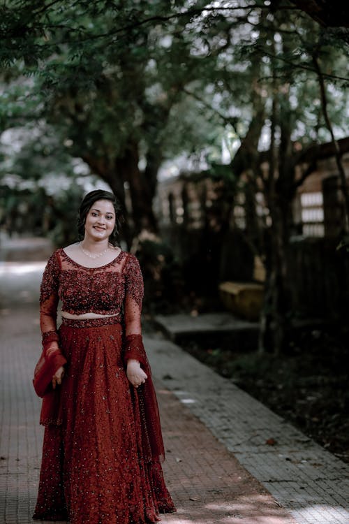 Smiling Woman in Red Dress