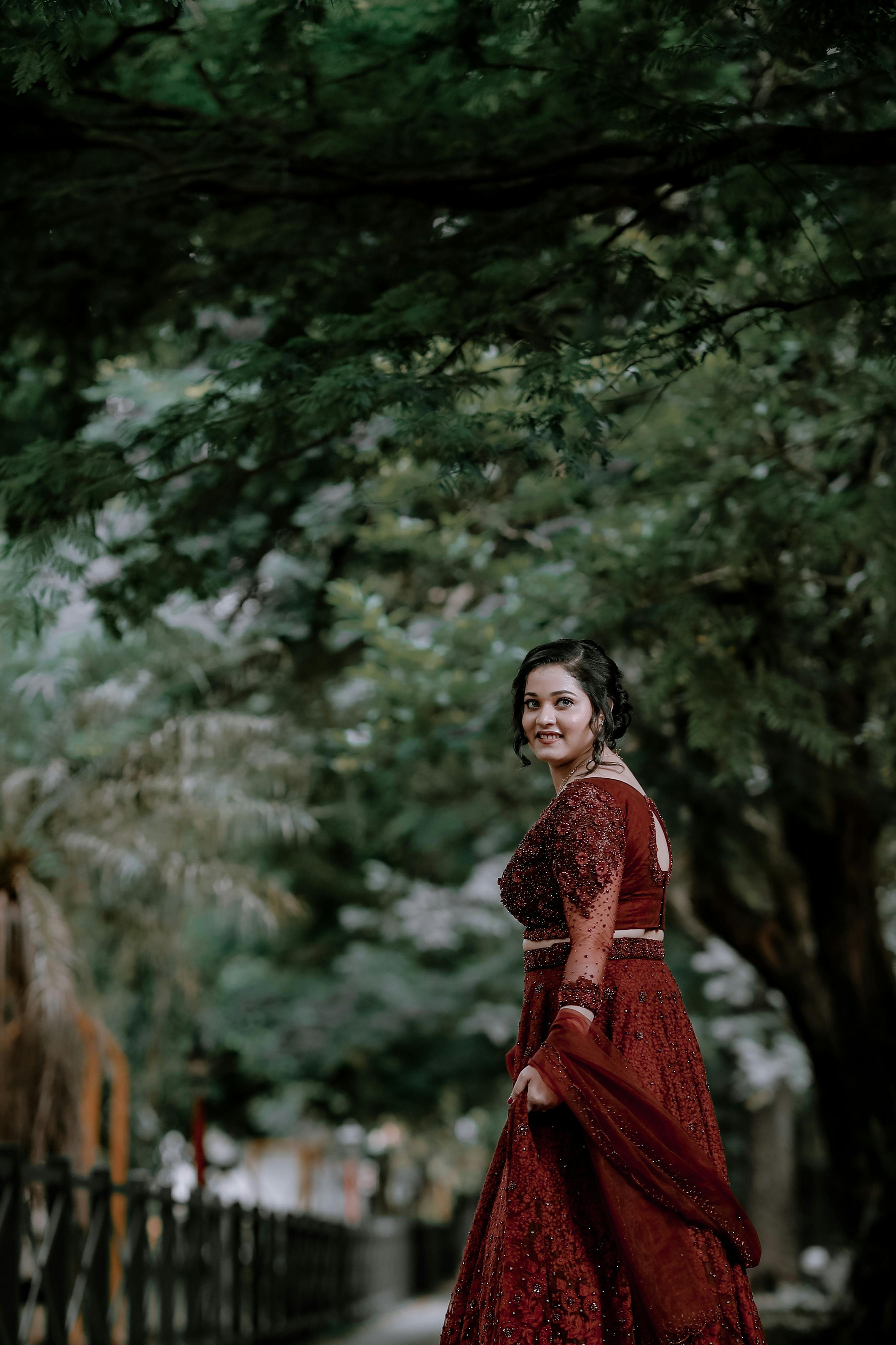 Premium Photo | Gorgeous young girl front pose wearing traditional dress  for photoshoot in garden