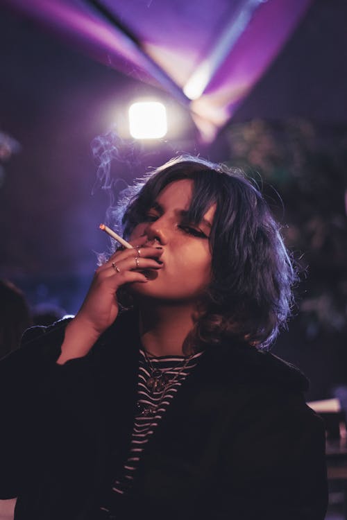 Young Woman Smoking a Cigarette 