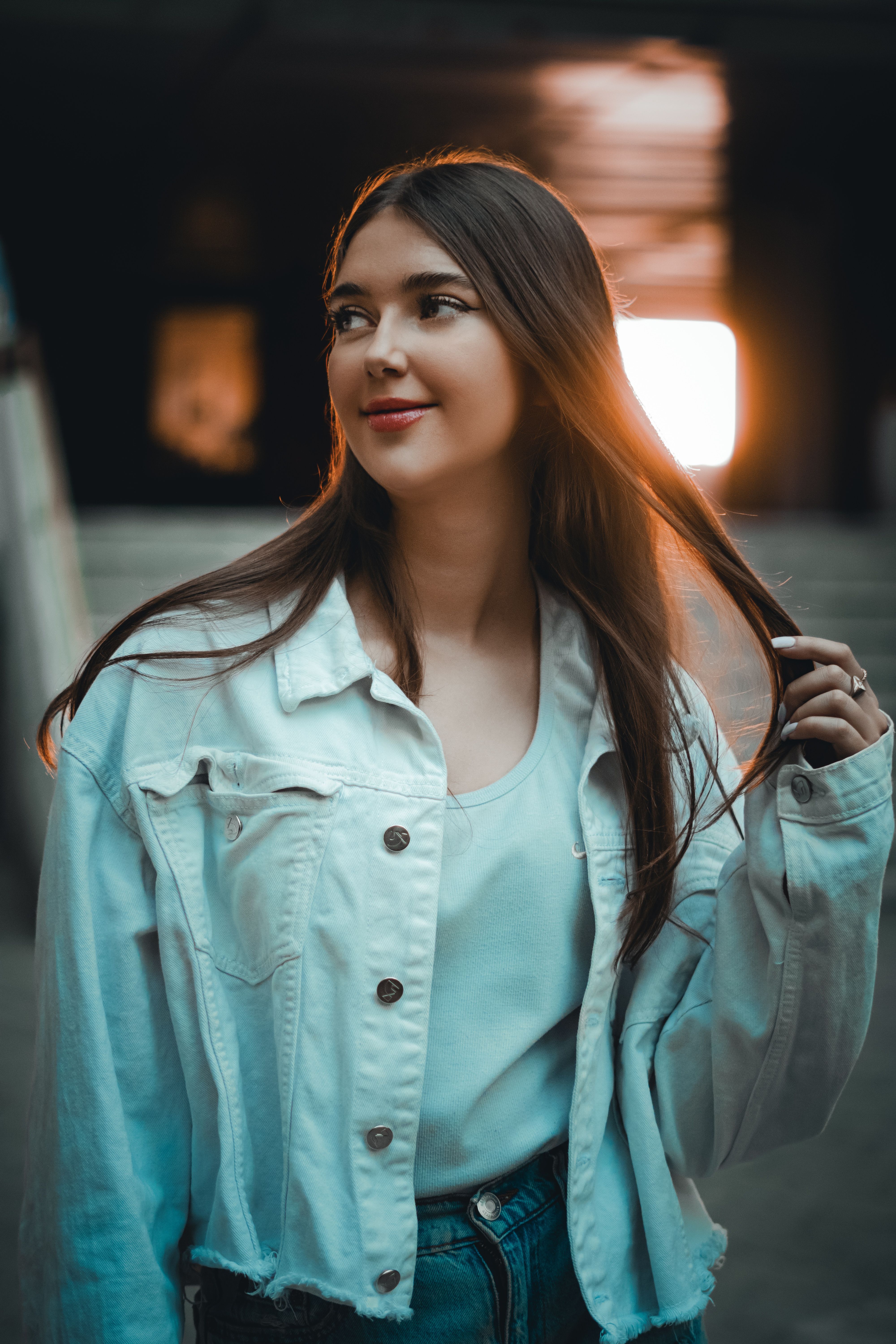 Young Woman in a Casual Outfit Standing and Smiling · Free Stock Photo