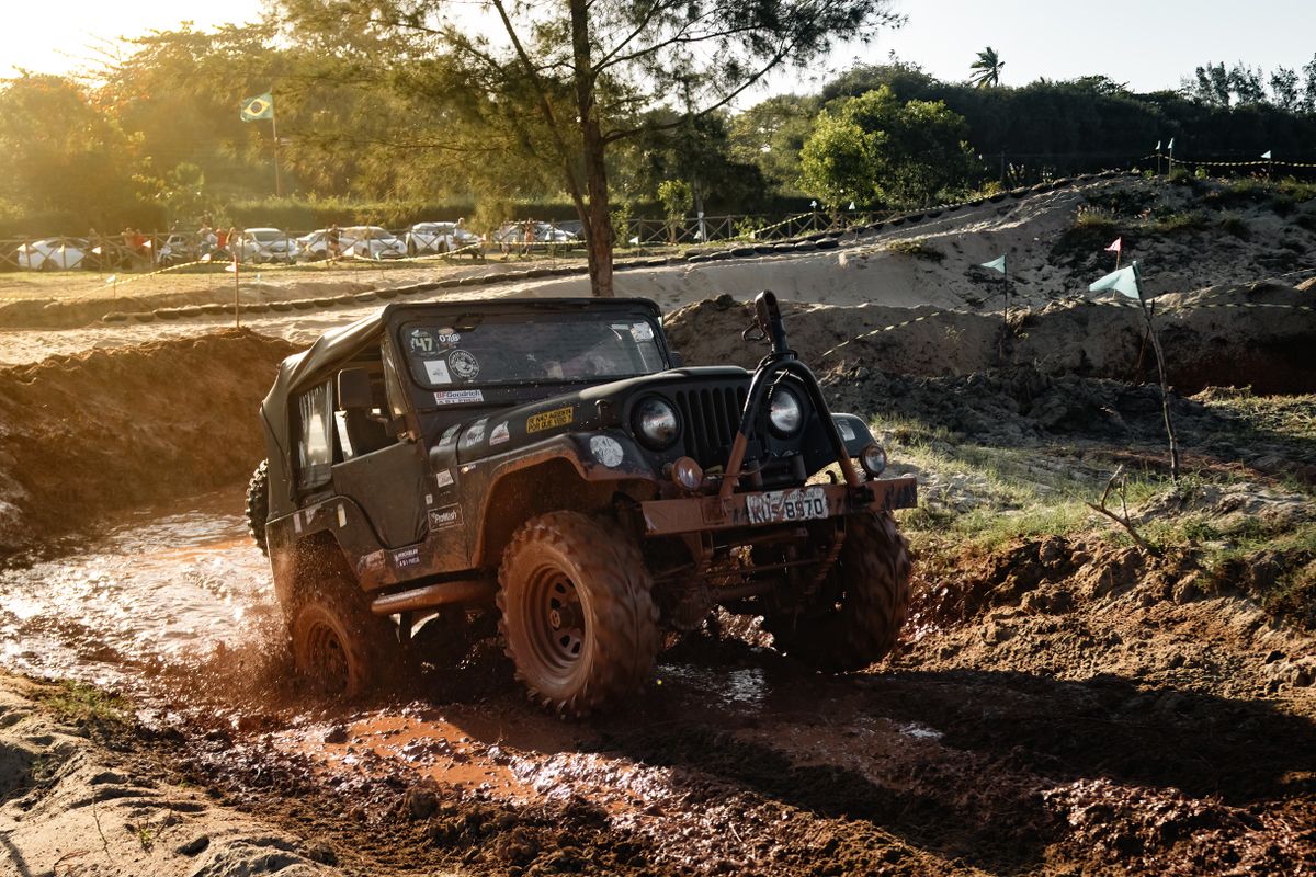 Jeep driving through mud