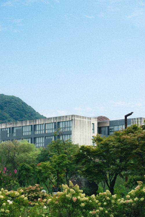 Free A modern architectural building surrounded by a lush garden in Paju, Gyeonggi-do, South Korea. Stock Photo
