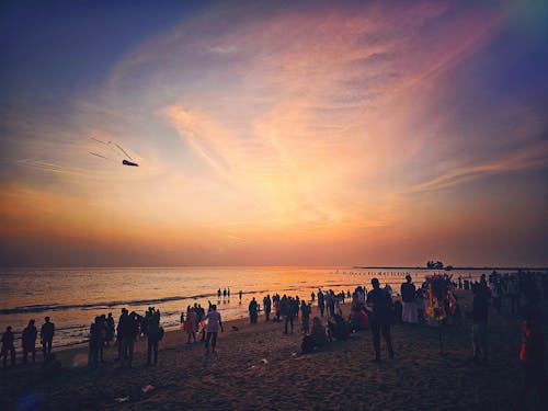 Kostenloses Stock Foto zu abend strand, abendhimmel, drachen