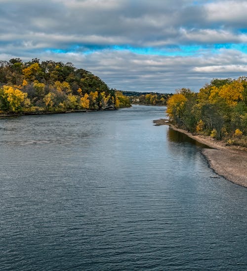 Scenic River and Trees in Autumn Foliage 