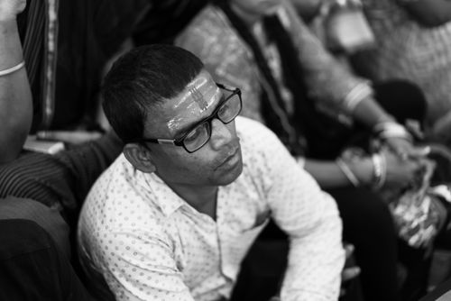 Free Monochrome image of a man with traditional forehead mark, wearing eyeglasses, capturing Indian culture. Stock Photo