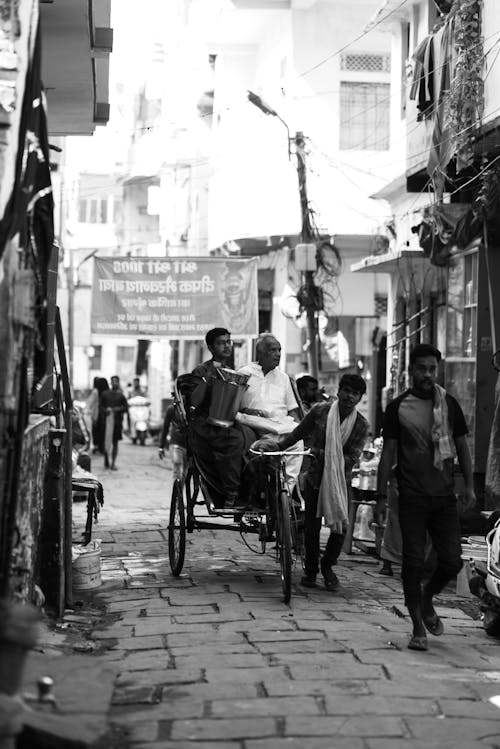 People in a Narrow Street in India in Black and White 