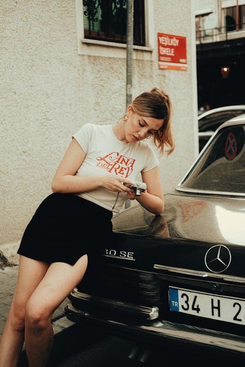 Woman in T-shirt and Mini