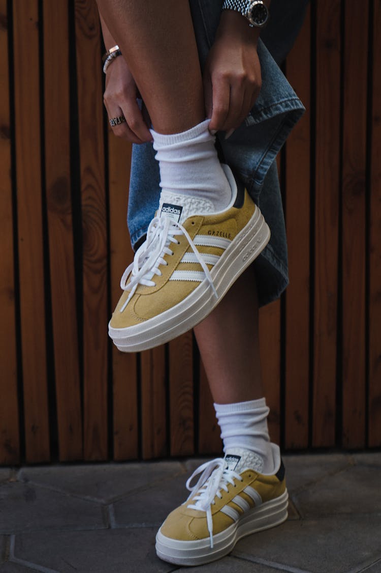 Person Fixing White Sock