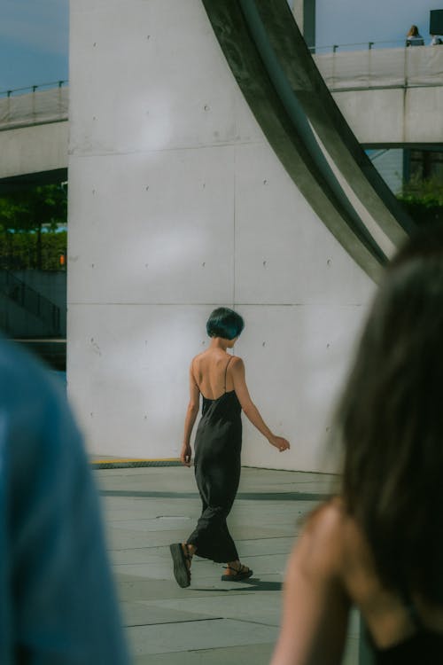 Woman in Black Dress Walking