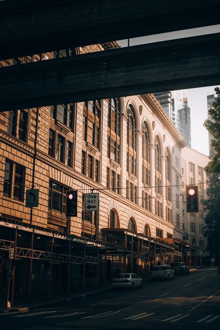 A scenic view of historic buildings under a dramatic sunset in the urban cityscape.