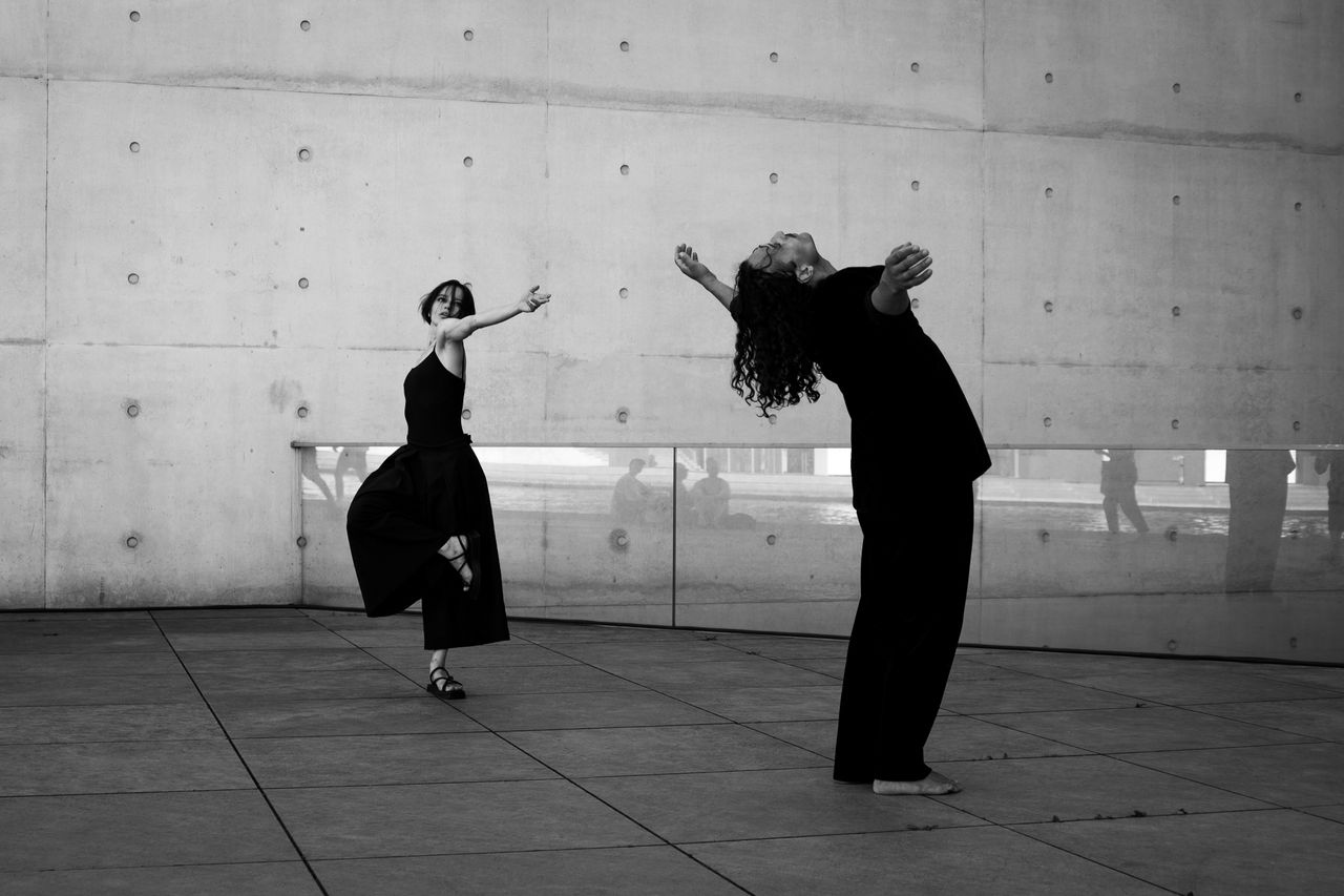 black and white image of dancers performing a contemporary routine out