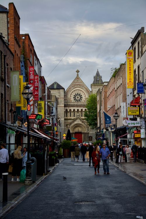Free Vibrant Grafton Street in Dublin featuring Saint Ann's Church with lively crowds and shops. Stock Photo