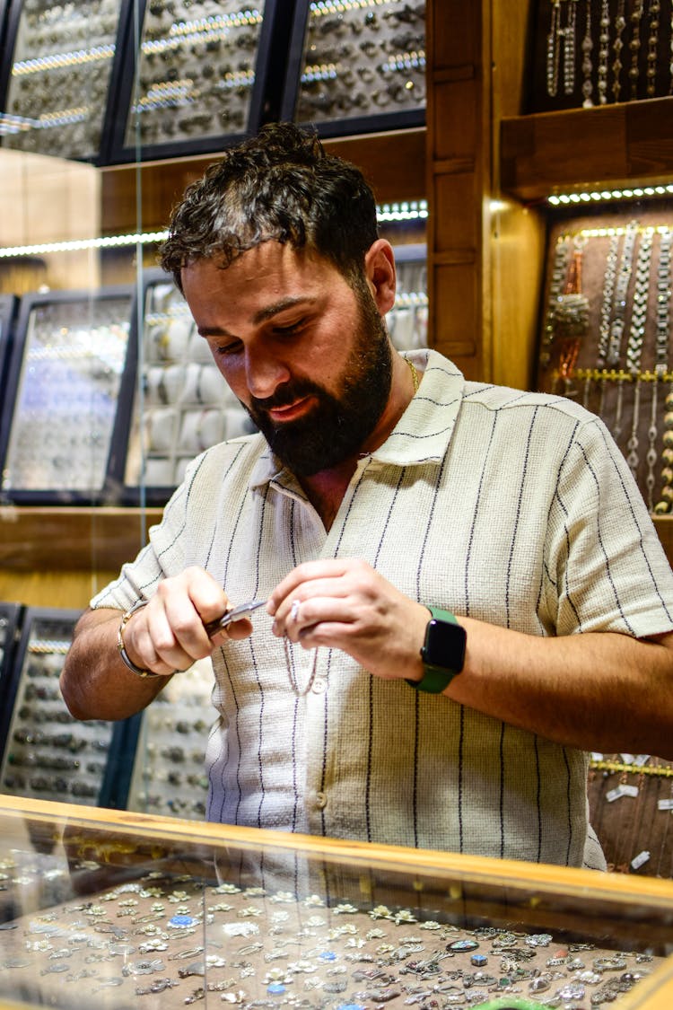 Jeweller Working In Store