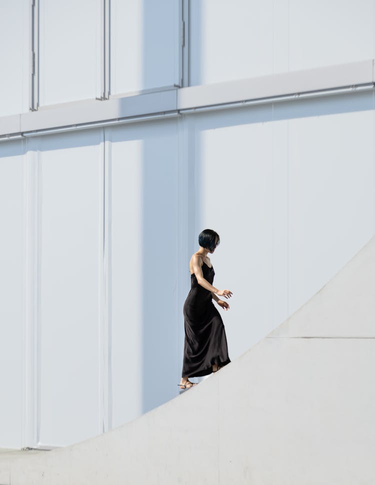 A Woman Walking Up The Stairs