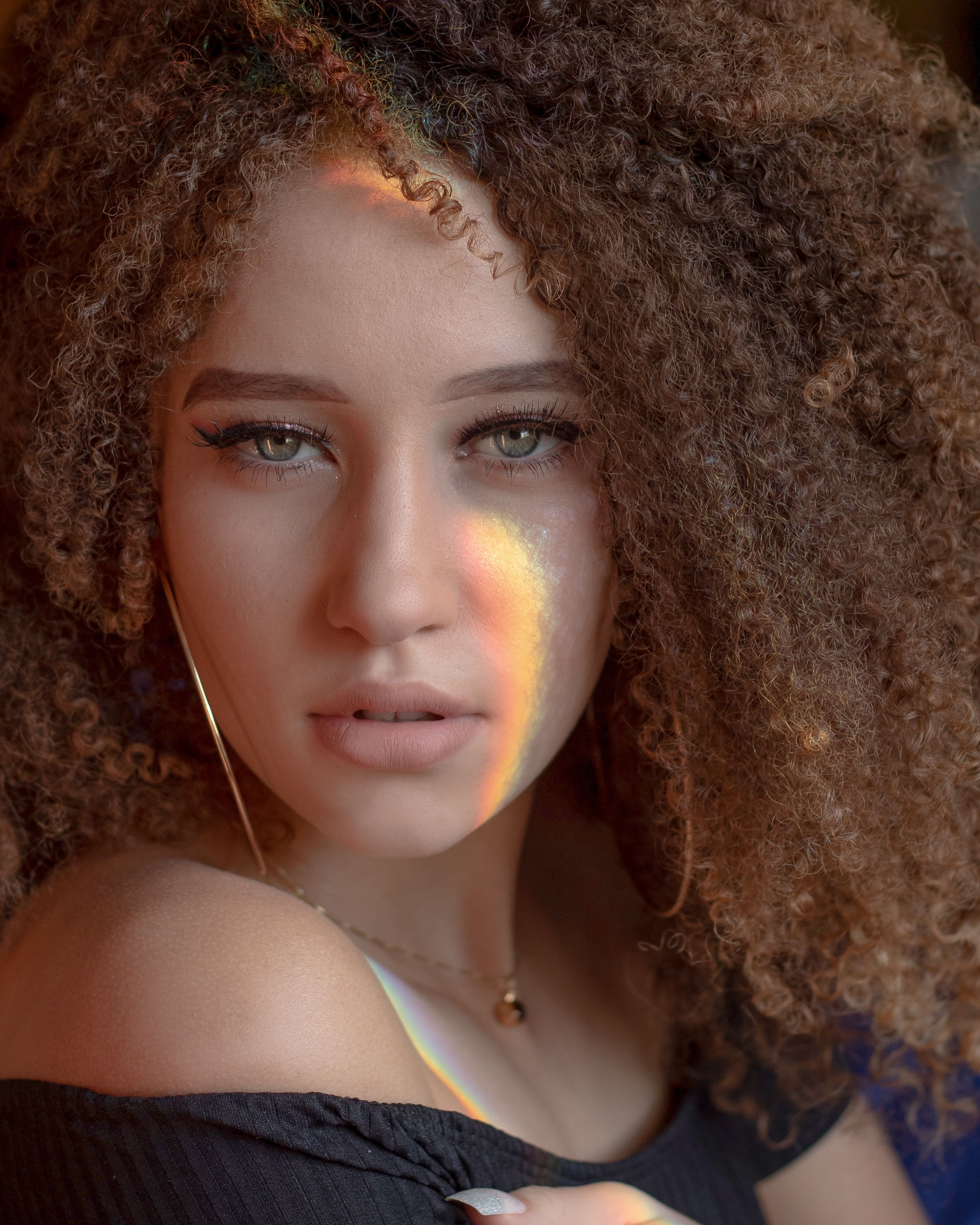 Portrait of Woman with Curly Hair · Free Stock Photo