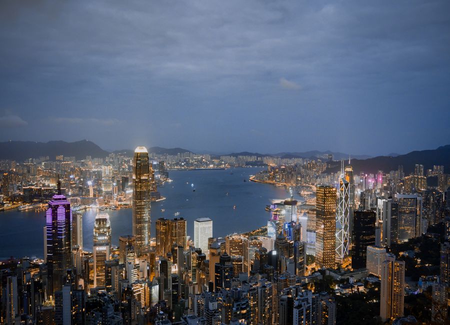 A breathtaking view of Hong Kong's illuminated skyline and harbor at night.