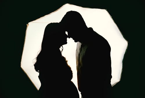 Silhouettes of a Man and a Woman in a Romantic Pose