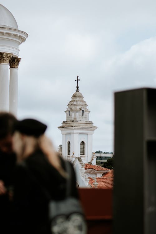 People Looking at Church Bell Tower