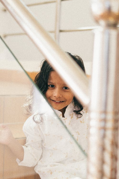 Little Girl Sitting on Stairs