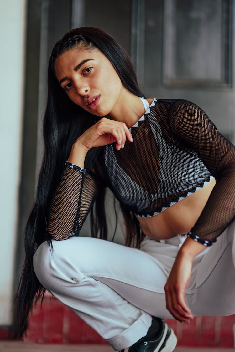 Brunette Woman Posing In Black Mesh Crop Top