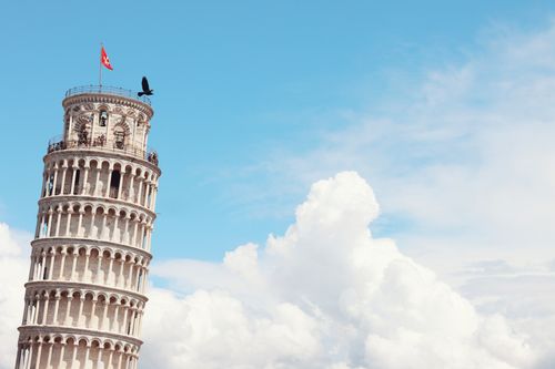 Free Iconic Leaning Tower of Pisa with clear sky and clouds, a must-see landmark. Stock Photo