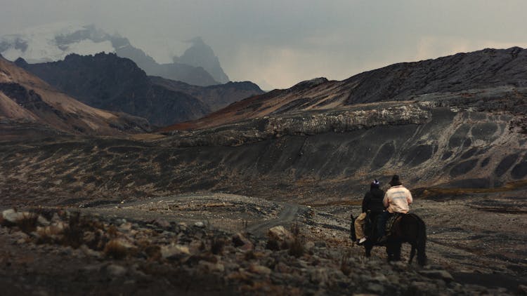 People Riding Horse In Mountains