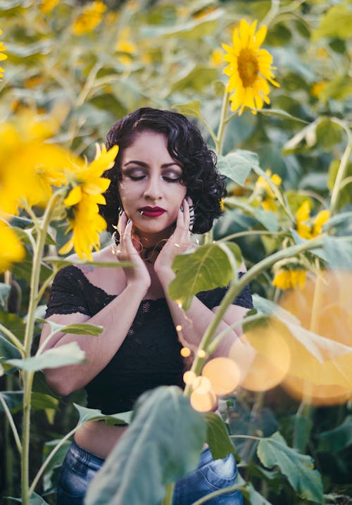 Photo of Woman In Sunflower Field