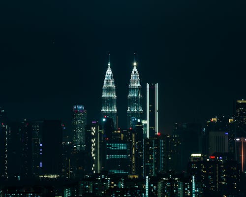 Illuminated Petronas Towers at Night in Kuala Lumpur, Malaysia 