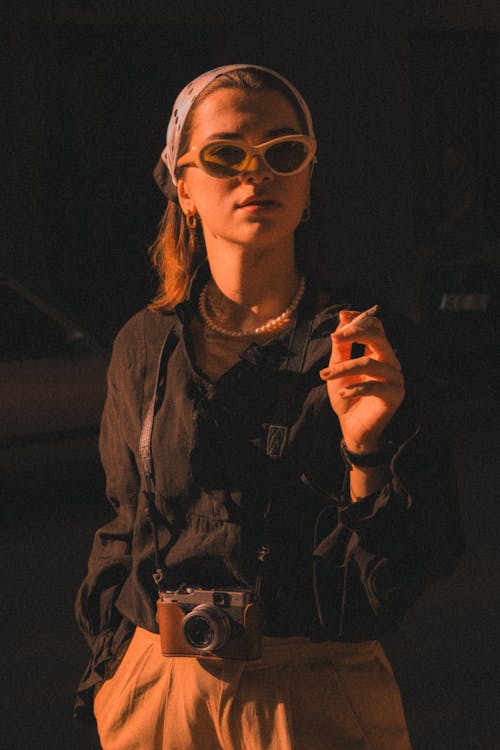 Woman in Sunglasses Smoking Cigarette