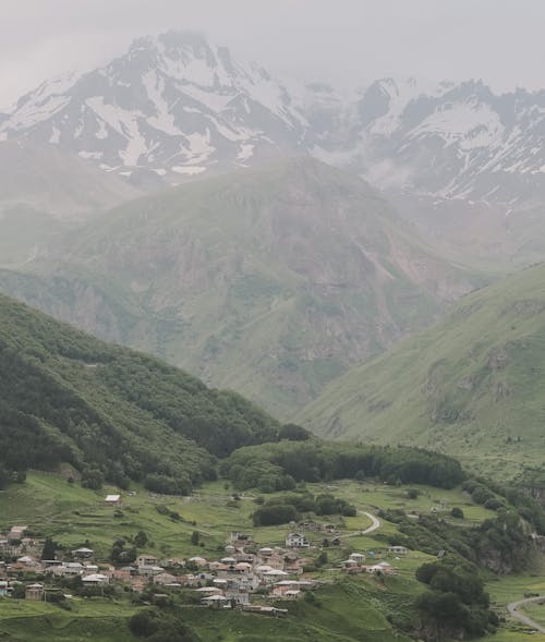 Mountain Panorama with a Village in a Valley