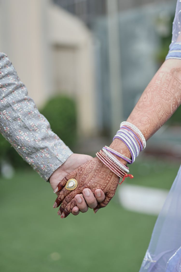 Newlyweds Holding Hands