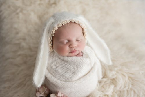 Picture of a Newborn Baby Wrapped in a Blanket with Bunny Ears 