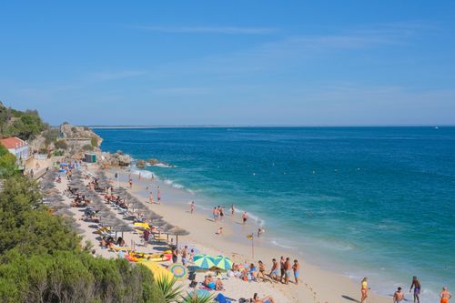 Free Relaxing summer day at Portinho da Arrábida beach in Setubal, Portugal. Stock Photo
