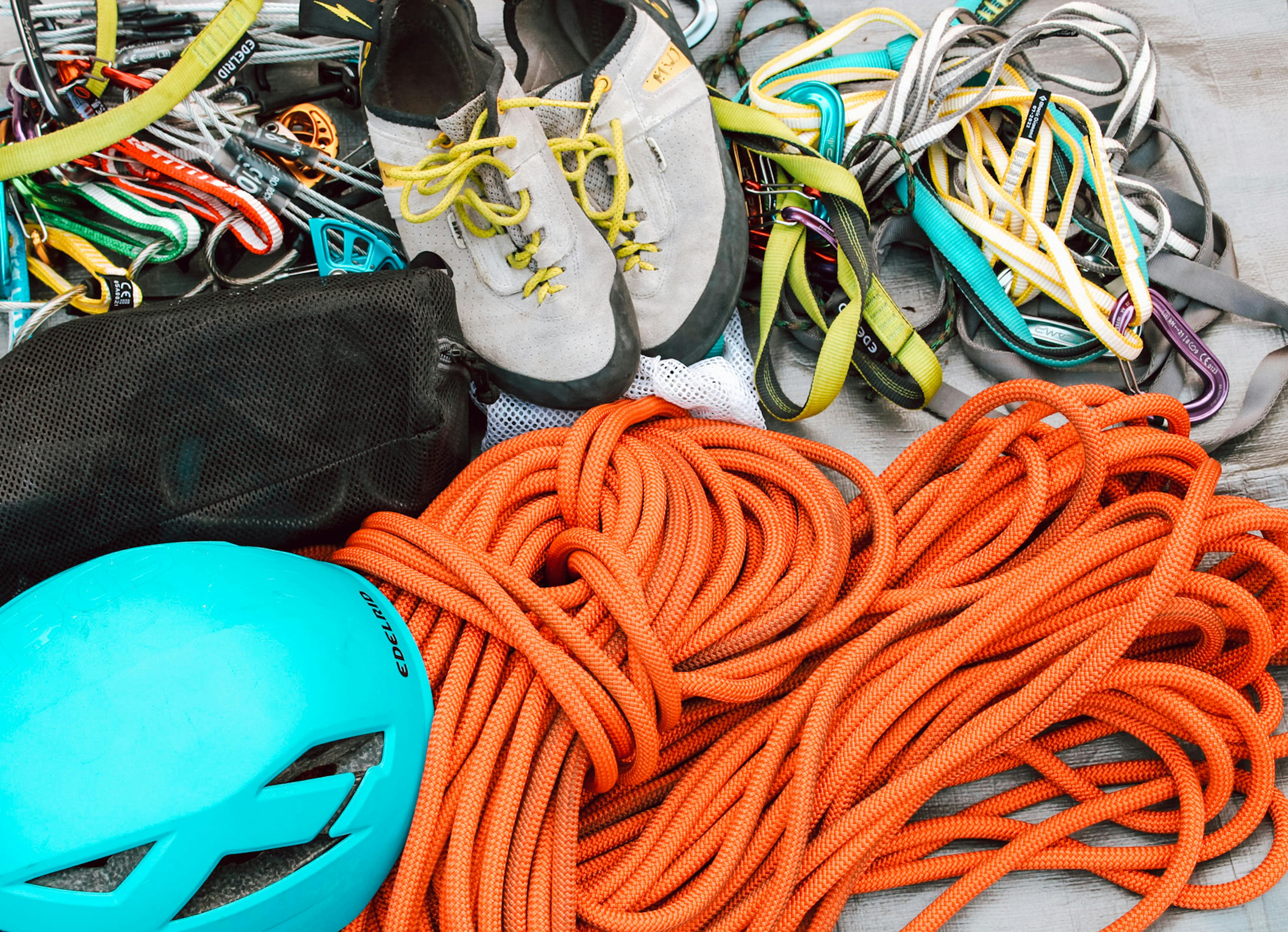 Climbing gear, harnesses, and ropes ready for an ascent