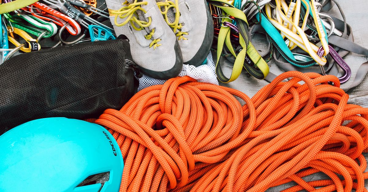 Climbing gear, harnesses, and ropes ready for an ascent