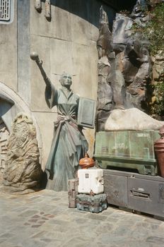 A detailed Star Wars-themed sculpture located in a theme park, embodying a sci-fi ambiance.