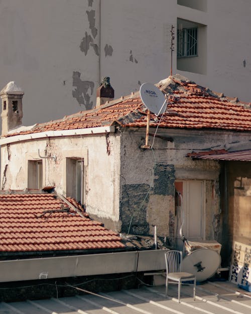 A Chair on the Roof of a House 