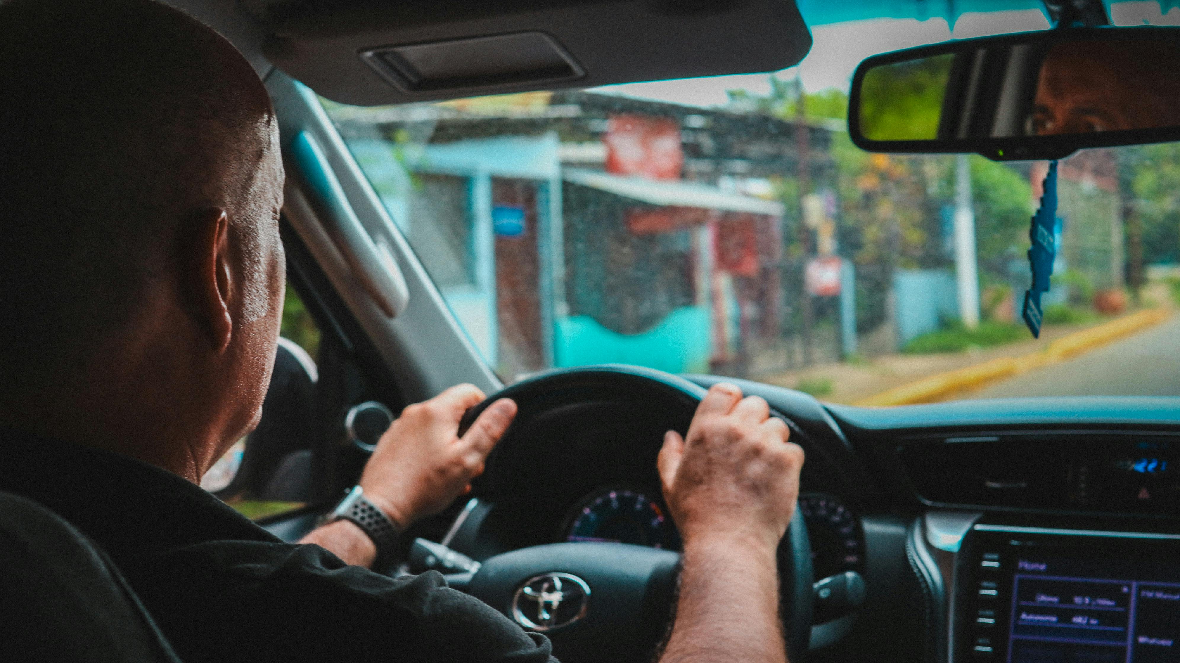 A Man Driving a Car · Free Stock Photo