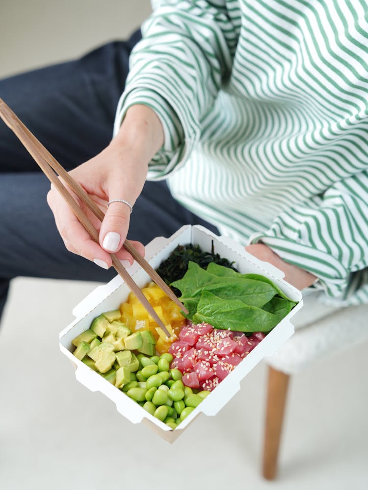 Woman Hand Holding Box With Food