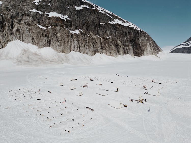 Camp In Snow With Mountain Behind