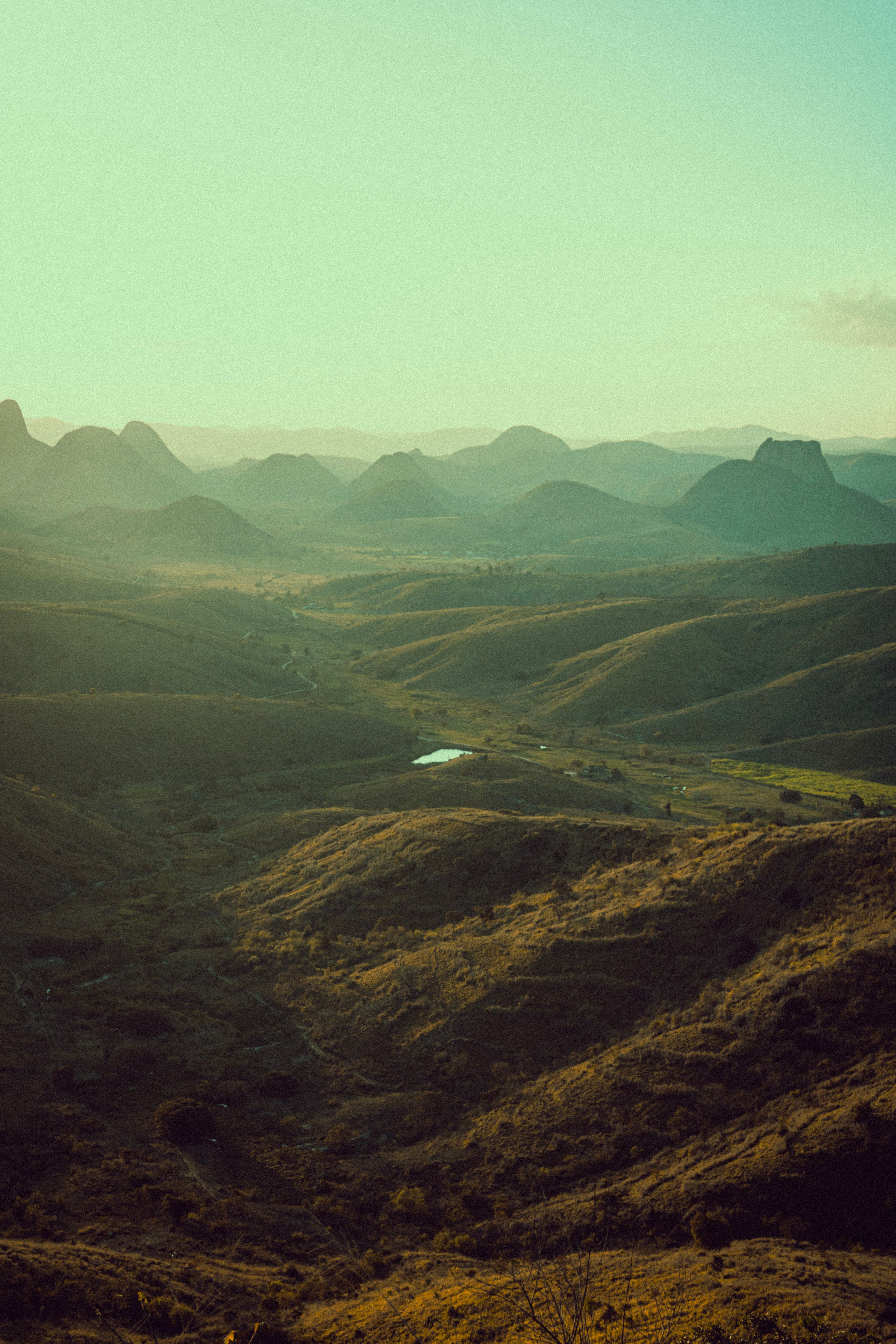 Stunning aerial view of Aldeia, Brazil's hills at sunset offering a serene natural landscape.