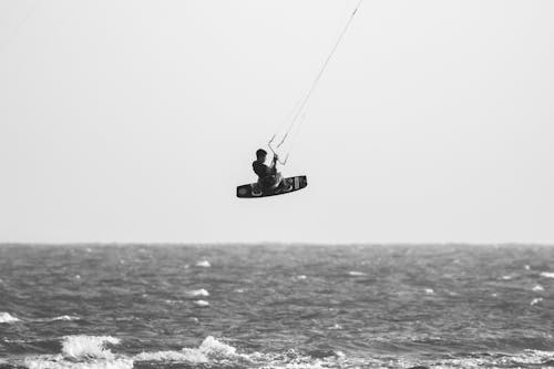 Kitesurfer Jumping over Sea Shore