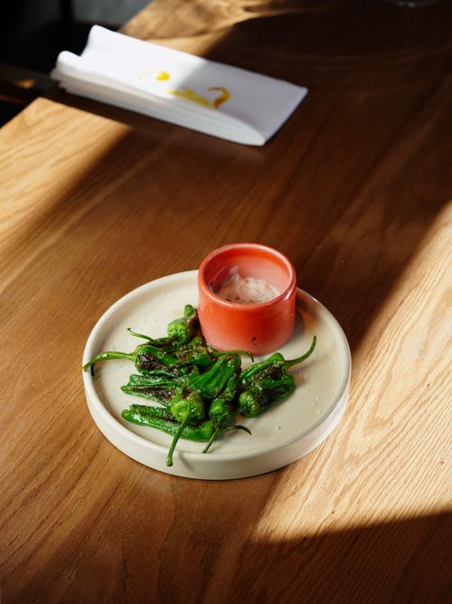 Free Plate of grilled green peppers served with a creamy dipping sauce. Stock Photo
