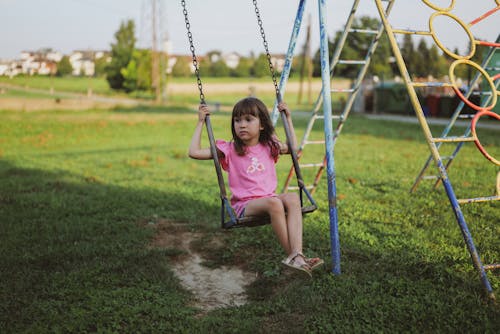 Girl on Swing on Playground